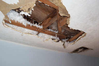 ceiling-drywall-hole-repair.png Damaged drywall ceiling with exposed framing before professional ceiling repair.
