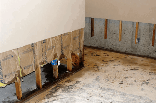 flood-damaged-drywall.png Flood-damaged drywall removed before restoration and mold prevention.